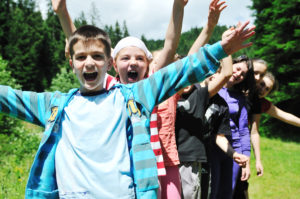 happy children group  have fun outdoor in nature at suny day
